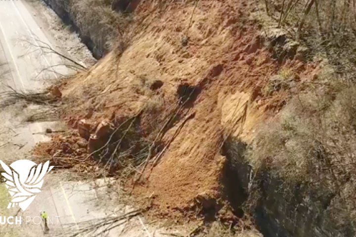 Give Without Payment Touchpoint; image of mudslide over a highway