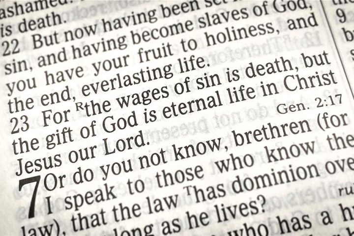 The Wages of Sin Is Death Touchpoint; image of open Bible highlighting scripture passage