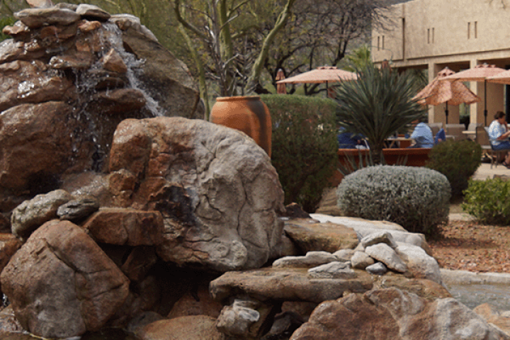 Touchpoint: On this rock I will build my church. Image of Spirit in the Desert Retreat Center fountain featuring rock formation.