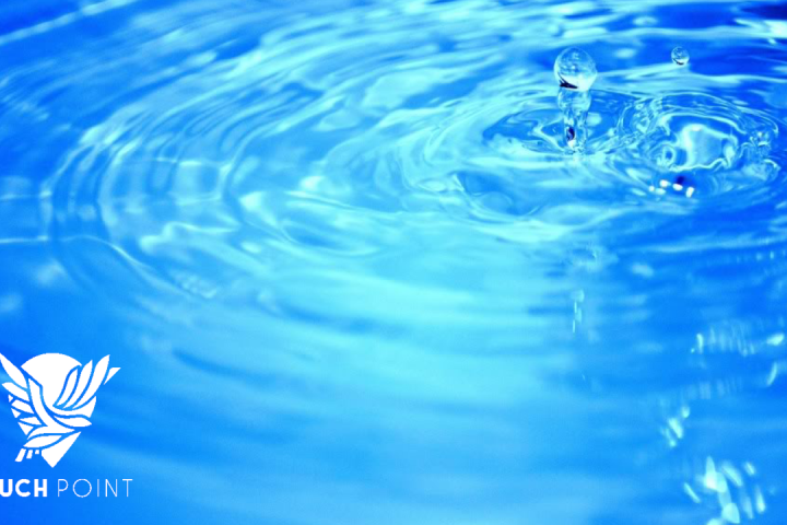 Touchpoint: Baptism; close-up photo of sparkling blue water clo