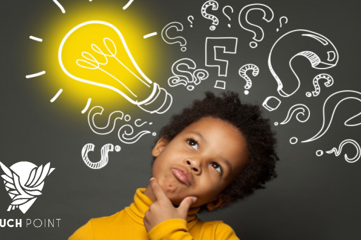 Touchpoint: Walk as children of light. Image of young boy gazing at a lightbulb with question marks on a chalkboard behind him